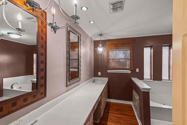 5651 Bretwood Dr, Keithville, LA 71047 - bathroom with wood finished floors, visible vents, vanity, and ornamental molding