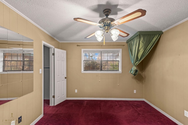 5651 Bretwood Dr, Keithville, LA 71047 - carpeted spare room featuring a textured ceiling, crown molding, baseboards, and a ceiling fan
