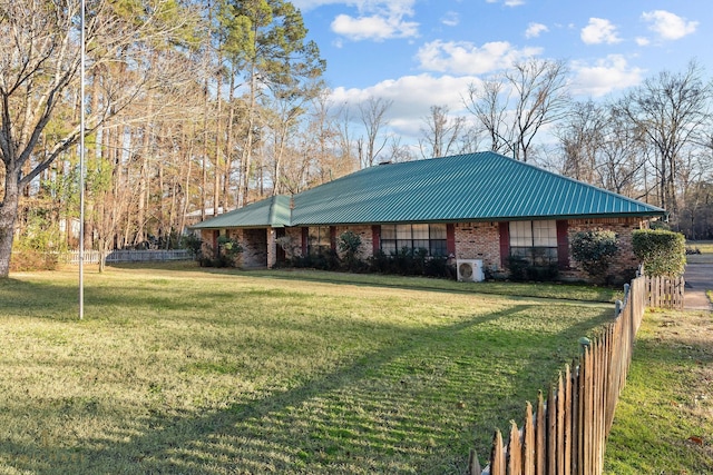 5651 Bretwood Dr, Keithville, LA 71047 - view of front of home with fence, a front lawn, and metal roof