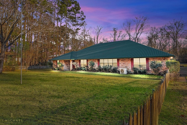 5651 Bretwood Dr, Keithville, LA 71047 - view of front of home with brick siding, a yard, metal roof, and fence