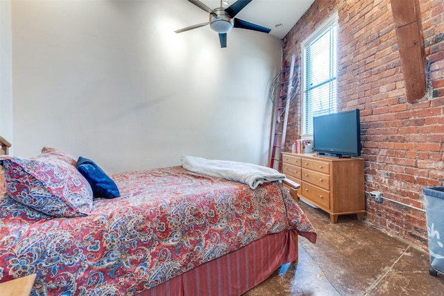 bedroom with ceiling fan and brick wall