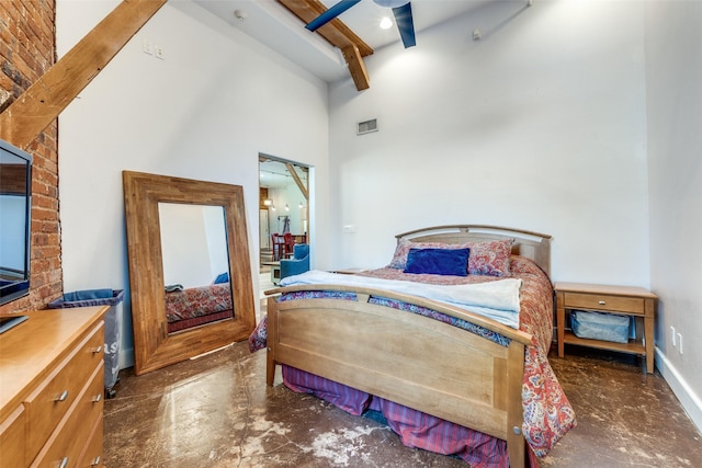 bedroom with a towering ceiling, baseboards, beamed ceiling, and visible vents