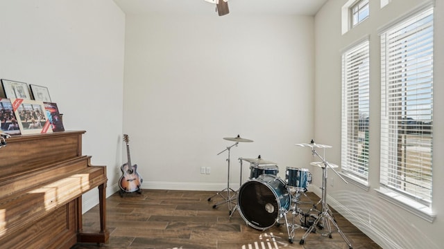 misc room featuring dark wood-style floors and baseboards