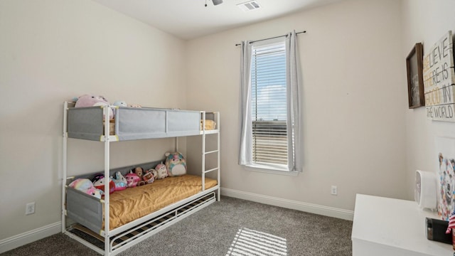 bedroom featuring multiple windows, visible vents, and baseboards