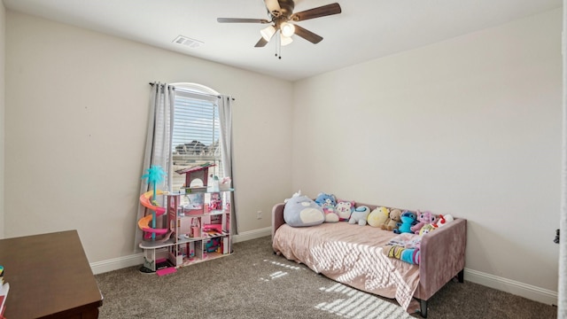 carpeted bedroom featuring a ceiling fan, visible vents, and baseboards