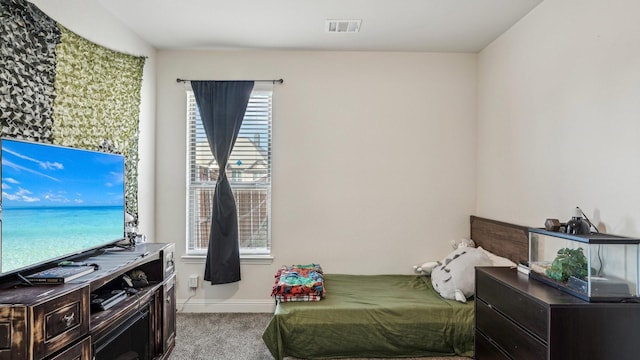 bedroom with light carpet, baseboards, and visible vents