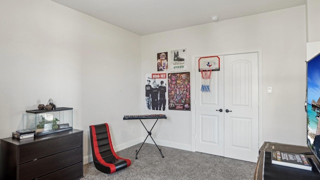 misc room with carpet floors and baseboards