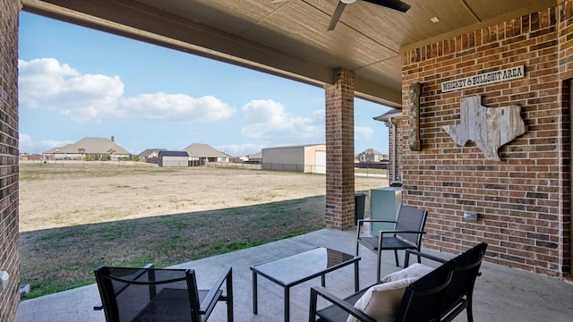 view of patio / terrace with ceiling fan, a residential view, and fence