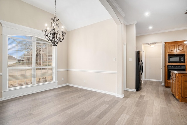 unfurnished dining area featuring baseboards, arched walkways, lofted ceiling, light wood-style flooring, and ornamental molding