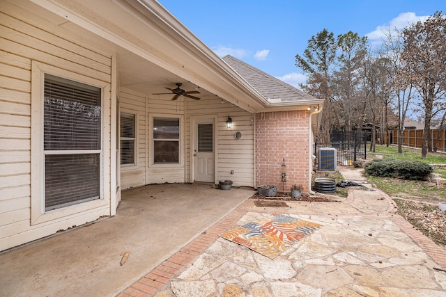 view of patio featuring ceiling fan, central AC, and fence