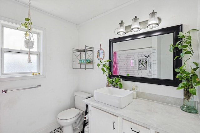 bathroom featuring toilet, a shower with shower curtain, vanity, baseboards, and crown molding