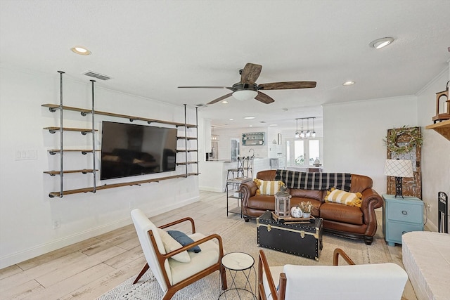 living area with a ceiling fan, recessed lighting, visible vents, and light wood finished floors