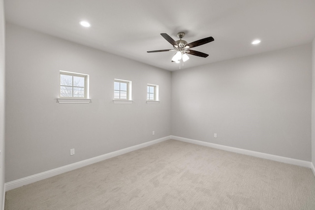 unfurnished room with recessed lighting, baseboards, ceiling fan, and light colored carpet