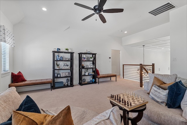 living area featuring a ceiling fan, recessed lighting, visible vents, and light carpet