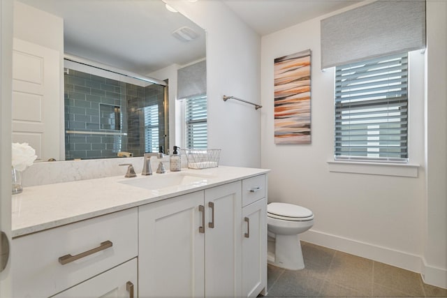 bathroom with a stall shower, baseboards, visible vents, toilet, and vanity