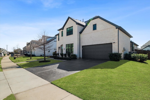 view of home's exterior with a yard, an attached garage, driveway, and stucco siding