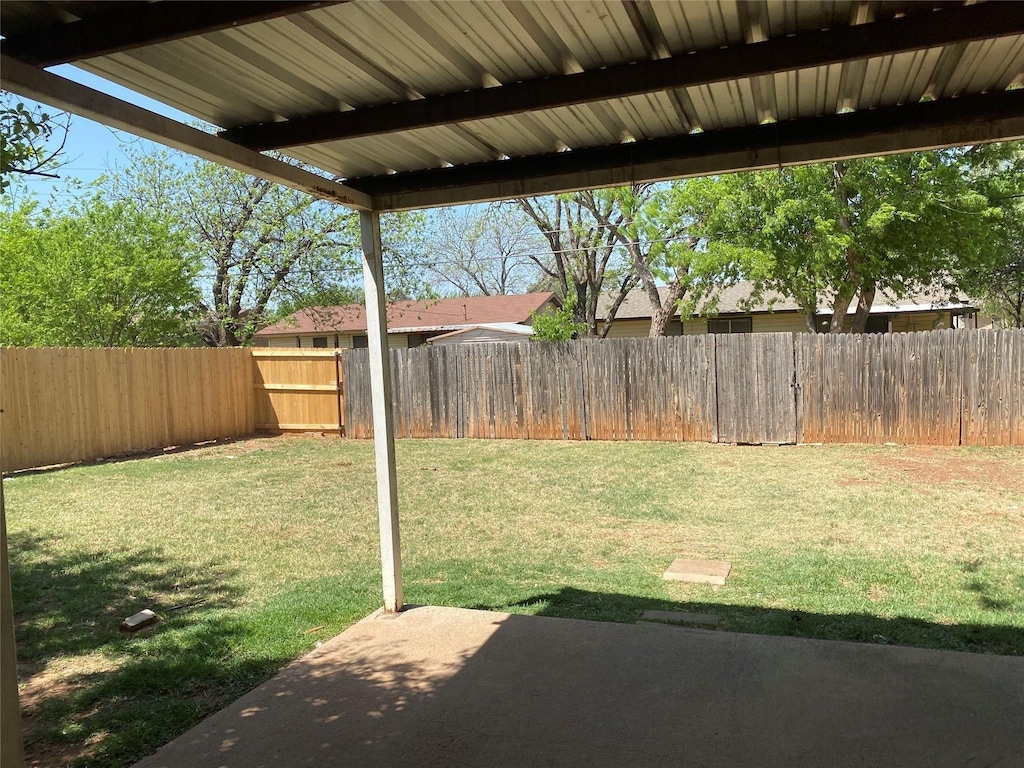 view of yard featuring a patio area and a fenced backyard