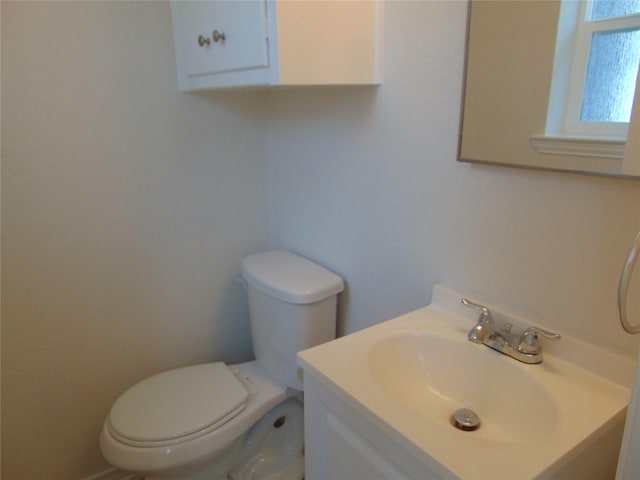 bathroom with toilet and vanity