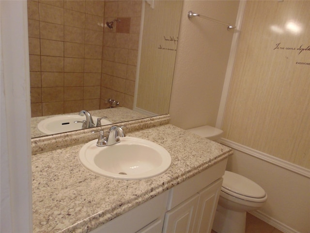 full bathroom with shower / bathtub combination, vanity, and toilet