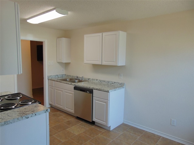 kitchen featuring light countertops, white cabinets, a sink, and stainless steel dishwasher