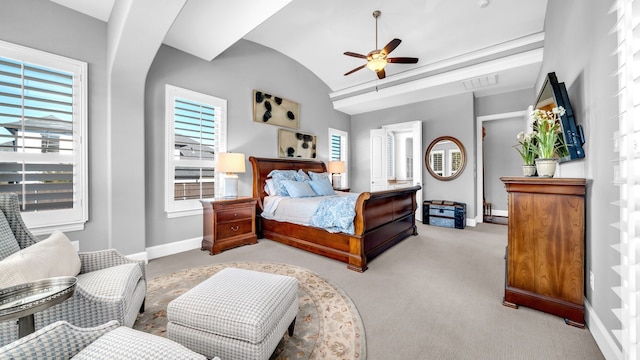 bedroom featuring lofted ceiling, baseboards, multiple windows, and visible vents