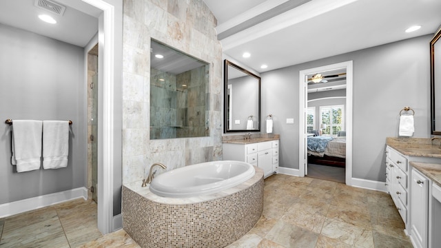 bathroom featuring a stall shower, visible vents, two vanities, and a bath