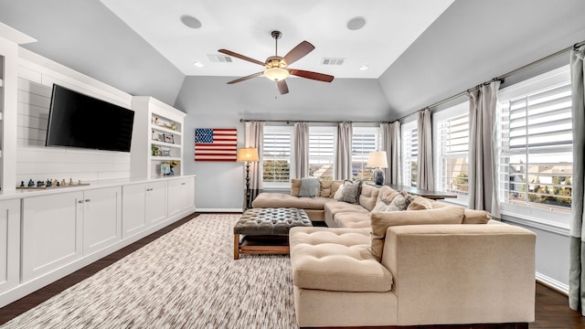 living room with lofted ceiling, dark wood-style floors, visible vents, and a ceiling fan