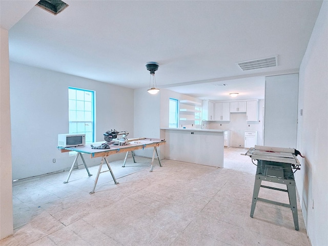 dining room featuring visible vents