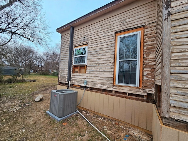 view of side of home with cooling unit