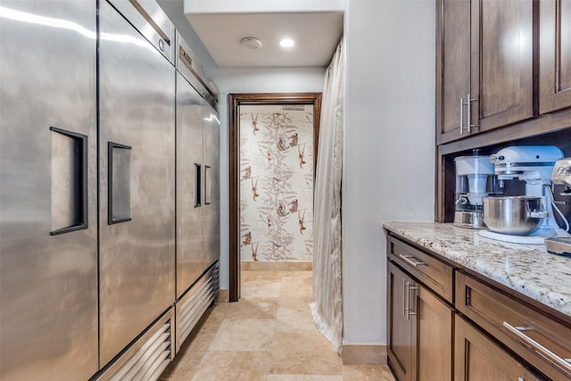 bathroom featuring vanity and baseboards