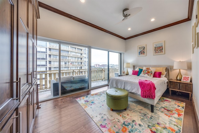 bedroom featuring dark wood-style floors, ornamental molding, recessed lighting, and access to exterior