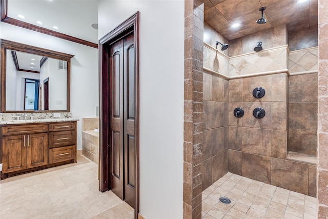 full bathroom with a stall shower, visible vents, ornamental molding, and vanity