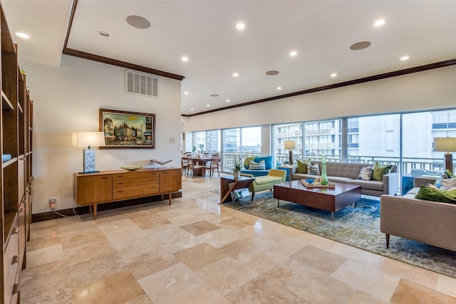 living area with ornamental molding, recessed lighting, visible vents, and baseboards