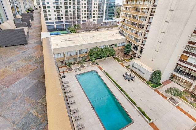 community pool with a patio area