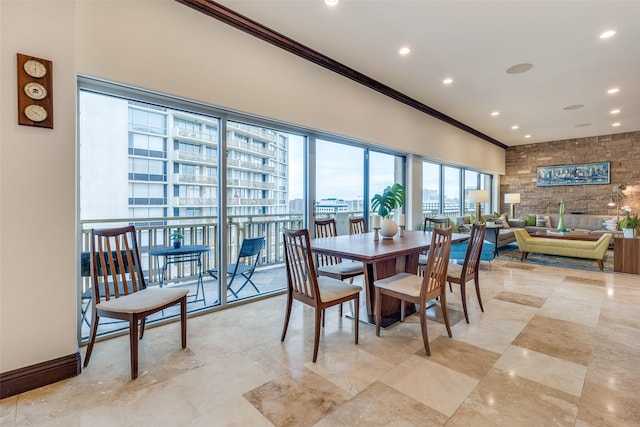 dining space featuring crown molding, a city view, and recessed lighting