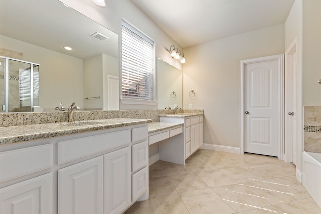 full bath with a sink, visible vents, a bath, tile patterned floors, and double vanity