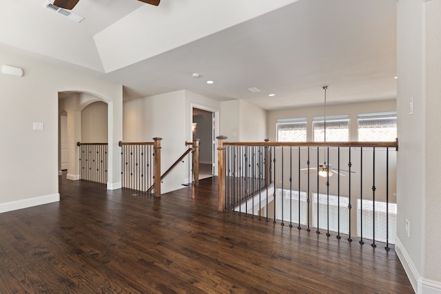 empty room with ceiling fan, recessed lighting, dark wood-type flooring, visible vents, and baseboards