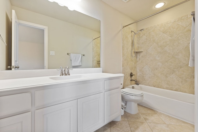 full bath with tile patterned flooring, shower / bath combination, vanity, and toilet