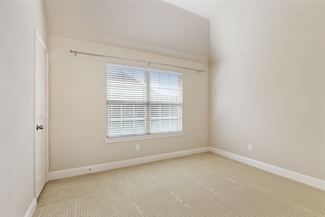 carpeted empty room with baseboards