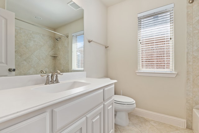 bathroom with visible vents, toilet, vanity, tile patterned flooring, and baseboards