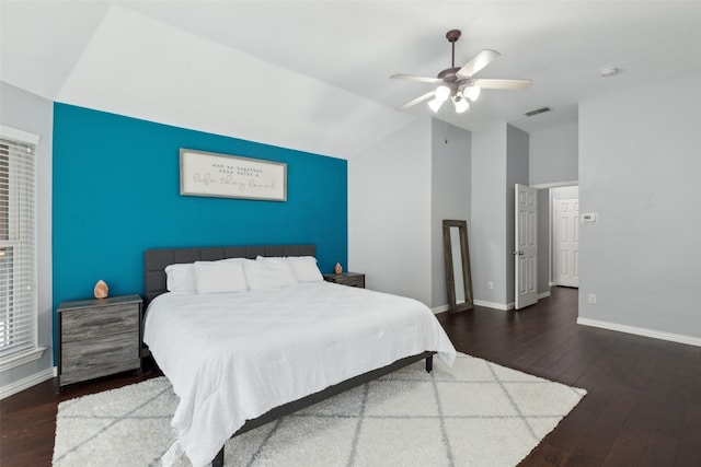 bedroom with visible vents, baseboards, dark wood finished floors, lofted ceiling, and ceiling fan