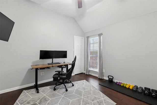 home office featuring ceiling fan, vaulted ceiling, baseboards, and wood finished floors