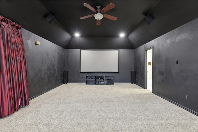 home theater with lofted ceiling, ceiling fan, recessed lighting, and light colored carpet