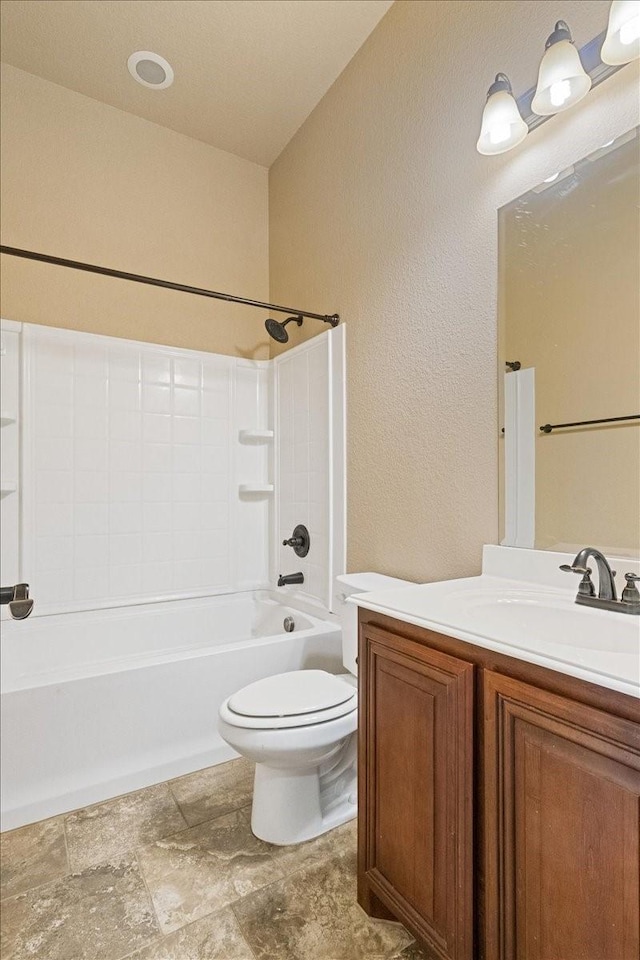 full bath featuring vanity, toilet, and shower / bathtub combination