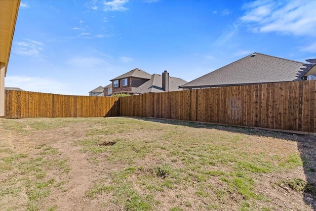 view of yard featuring a fenced backyard