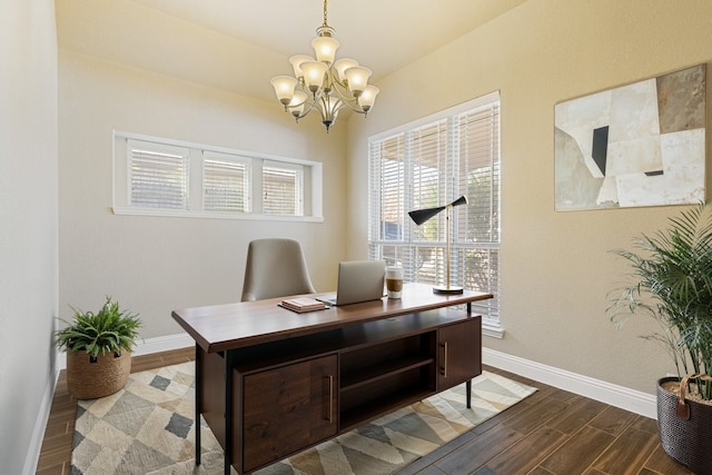 office space featuring dark wood-style floors, baseboards, and a chandelier