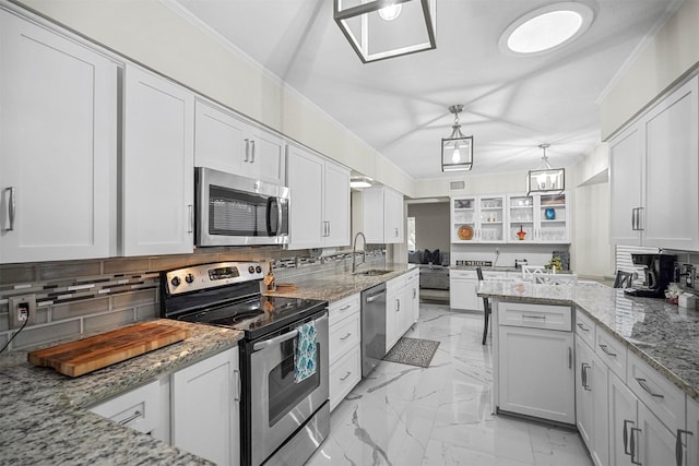 kitchen featuring glass insert cabinets, marble finish floor, white cabinetry, and appliances with stainless steel finishes