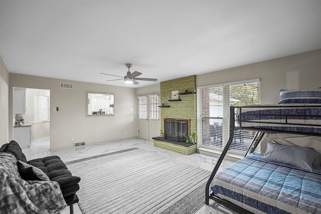 bedroom with marble finish floor, multiple windows, and visible vents