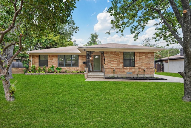 ranch-style home with brick siding and a front lawn