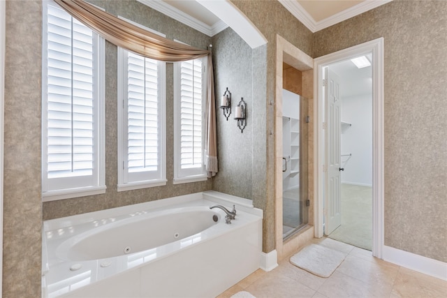 bathroom featuring crown molding, a spacious closet, tile patterned flooring, a jetted tub, and wallpapered walls